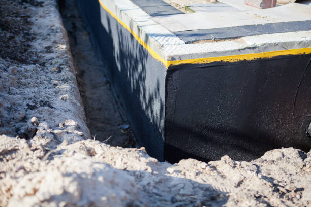 Professional Waterproofing technician working in Bear Creek, AL